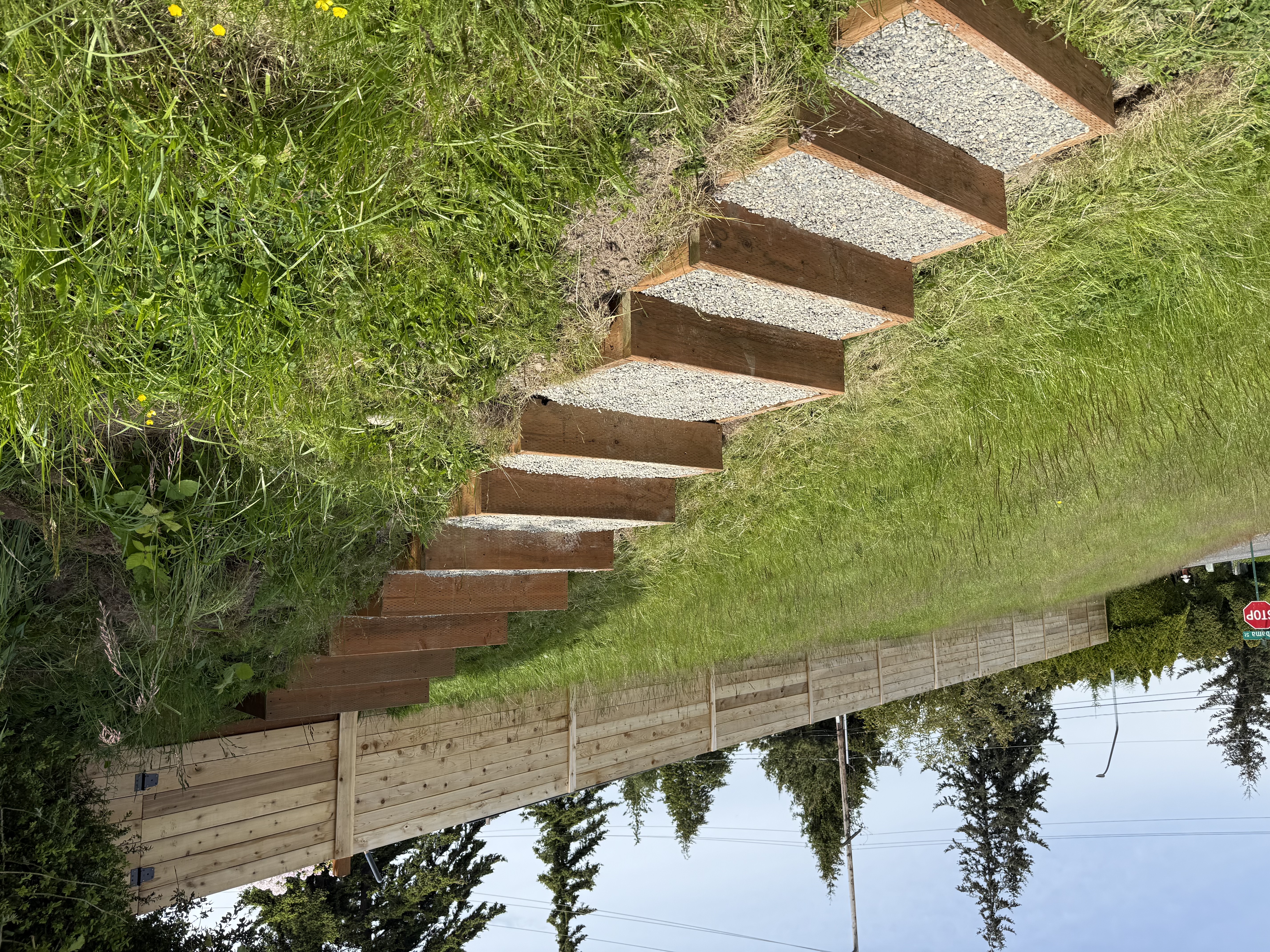 Custom garden stairs and sod-roofed fence