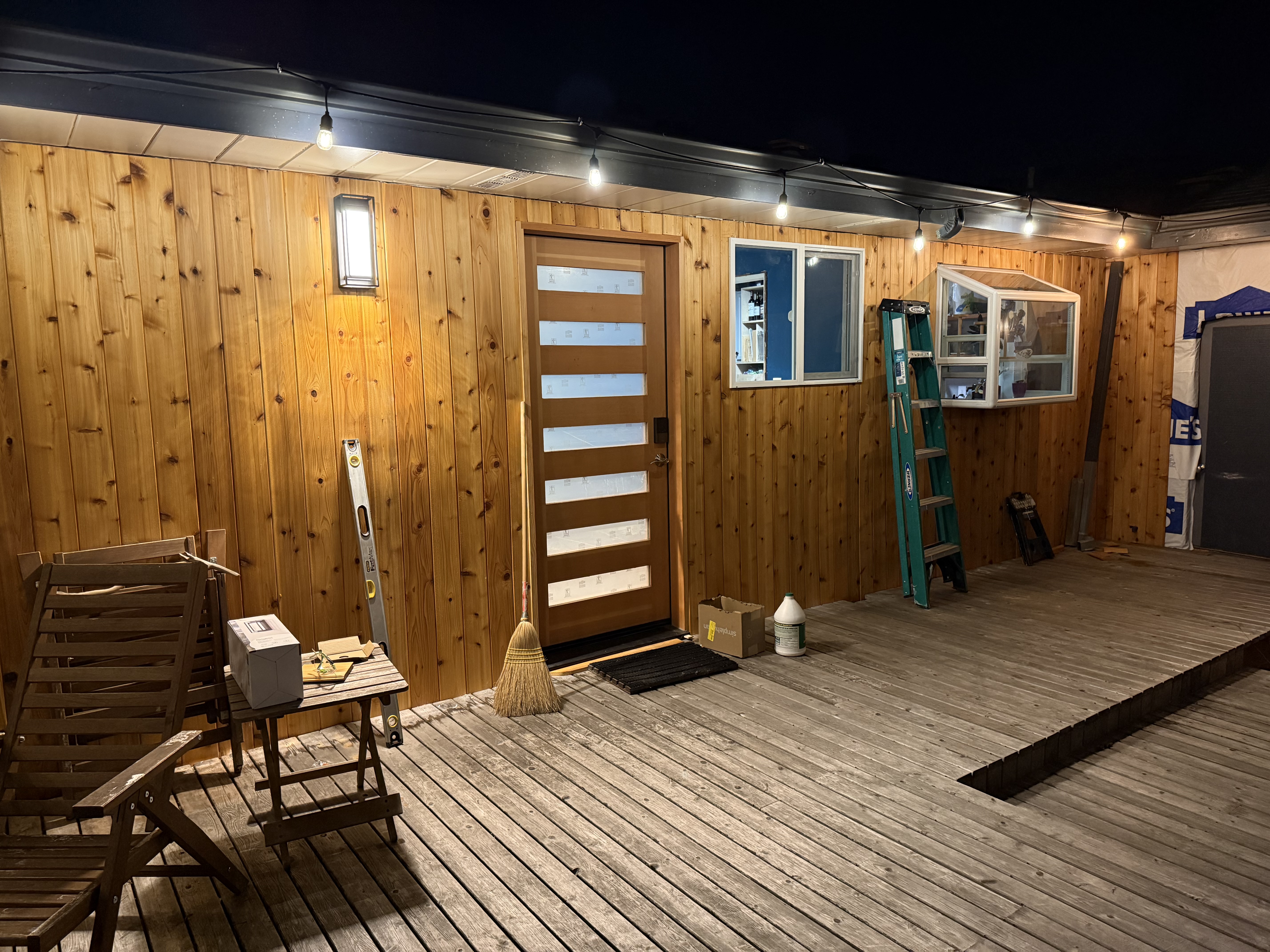 New custom exterior door installation at night