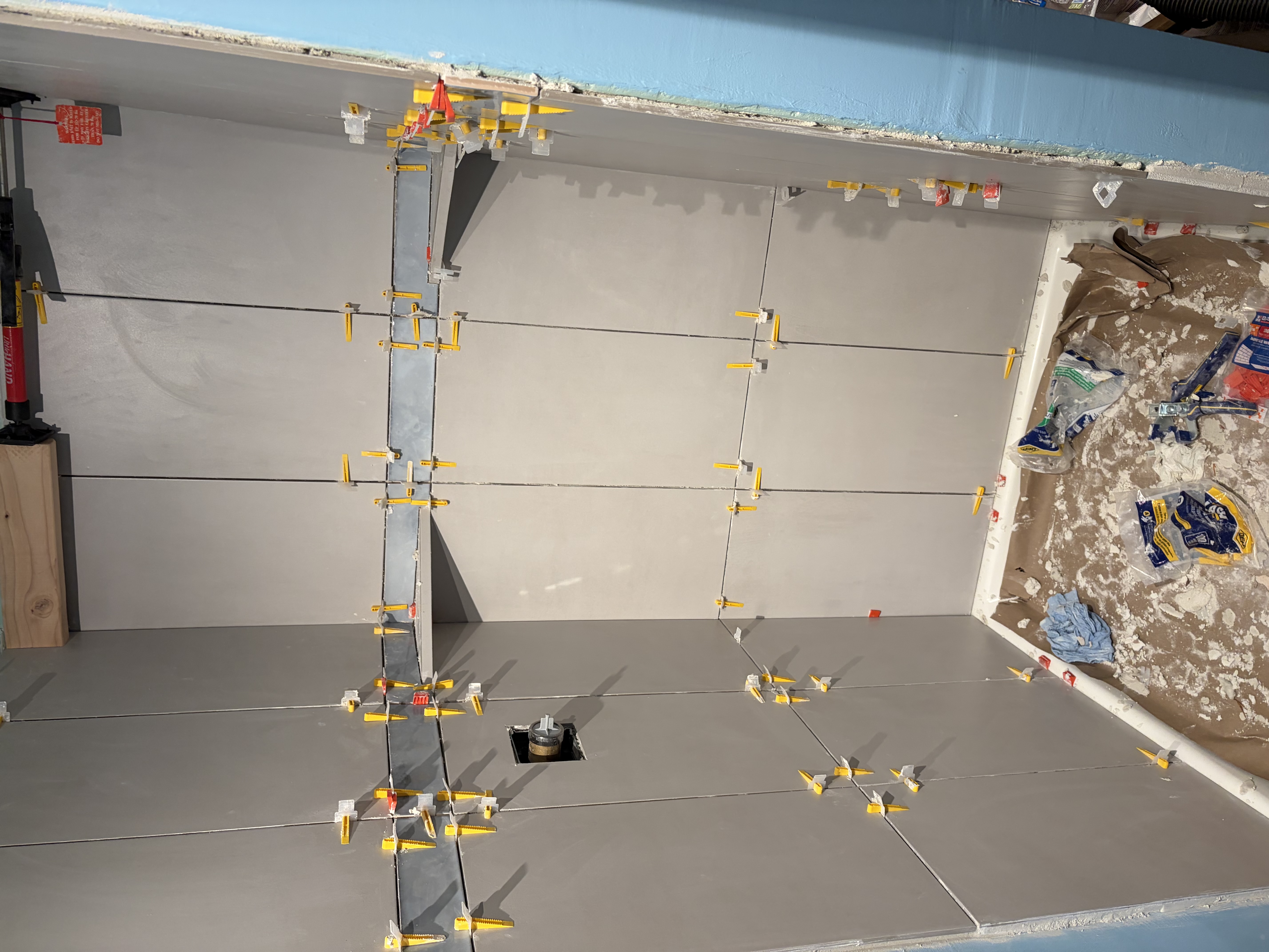 Precision tile installation in a bathroom shower